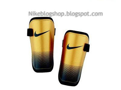 SP0145 NIKE ESPINILLERA DORADA